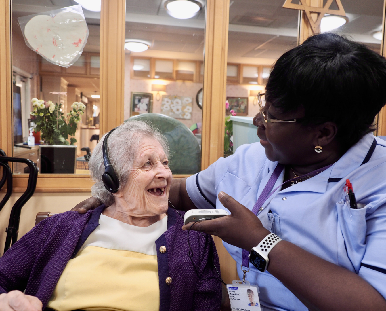 Engage Bespoke Service image showing a member of staff communication with a home resident