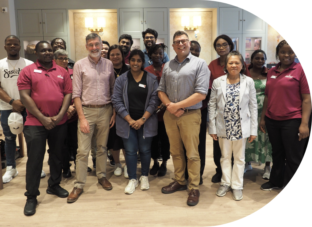 Engage | our team engaging with staff at a care home. Smiles all around