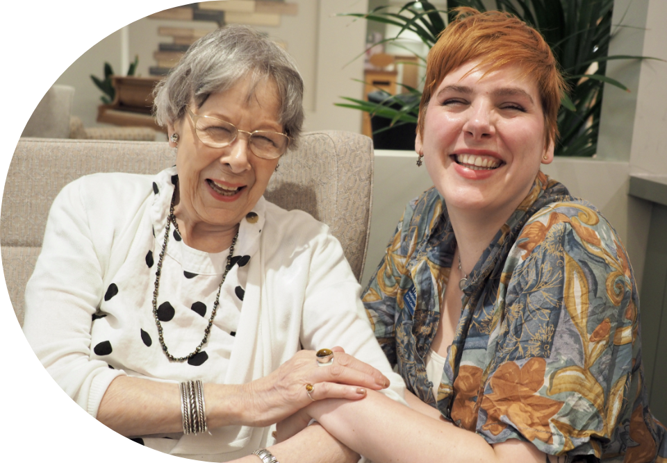 Engage | an image of a care home resident and member of staff interacting