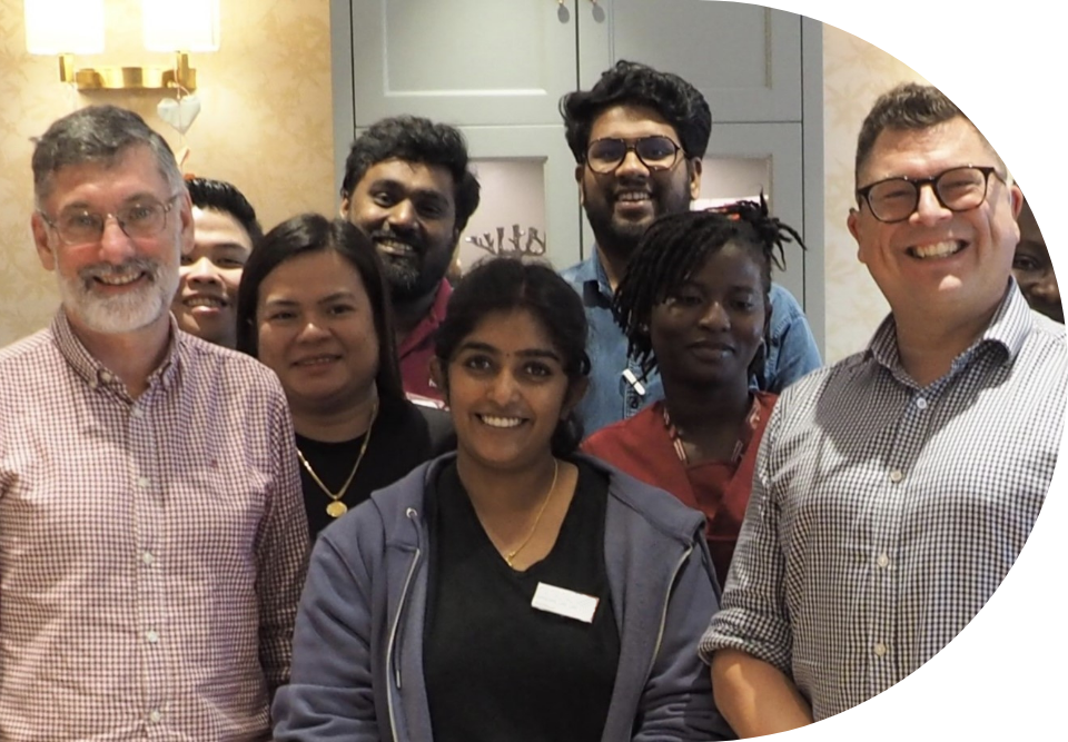 Engage | image of our team with staff at a care home