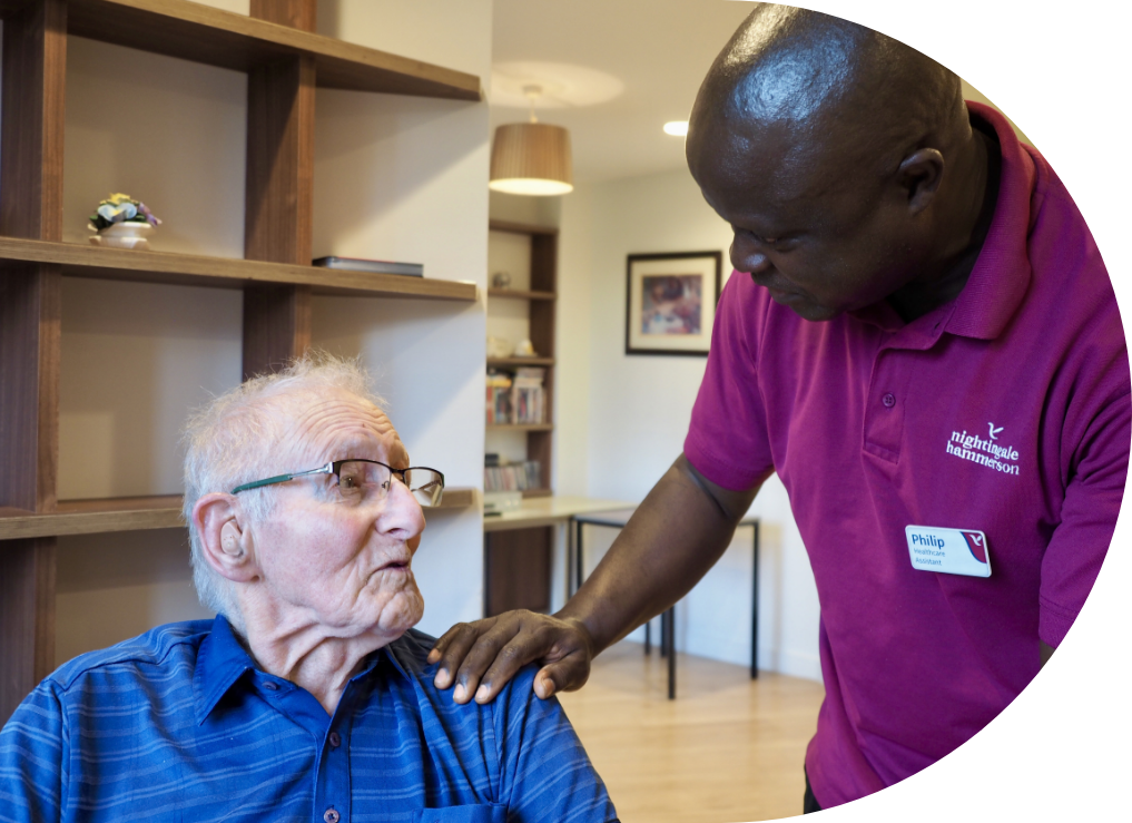 Engage | a member of the Nightingale Hemmerson staff insteracting with a resident