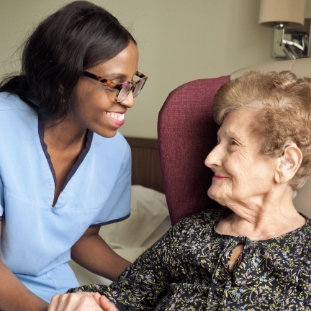 Engage | a member of the Jewish Care staffing team interacting with a resident