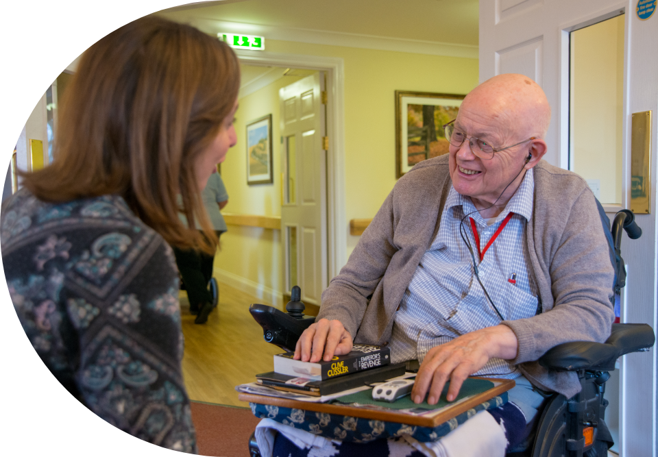 Engage | an image of our one or team interacting with a care home resident