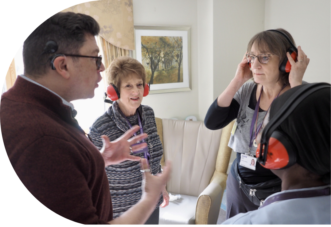 Engage | image showing Andrew training members of a care staff