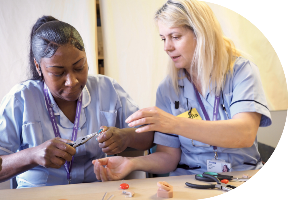 Engage | an image showing two members of care staff