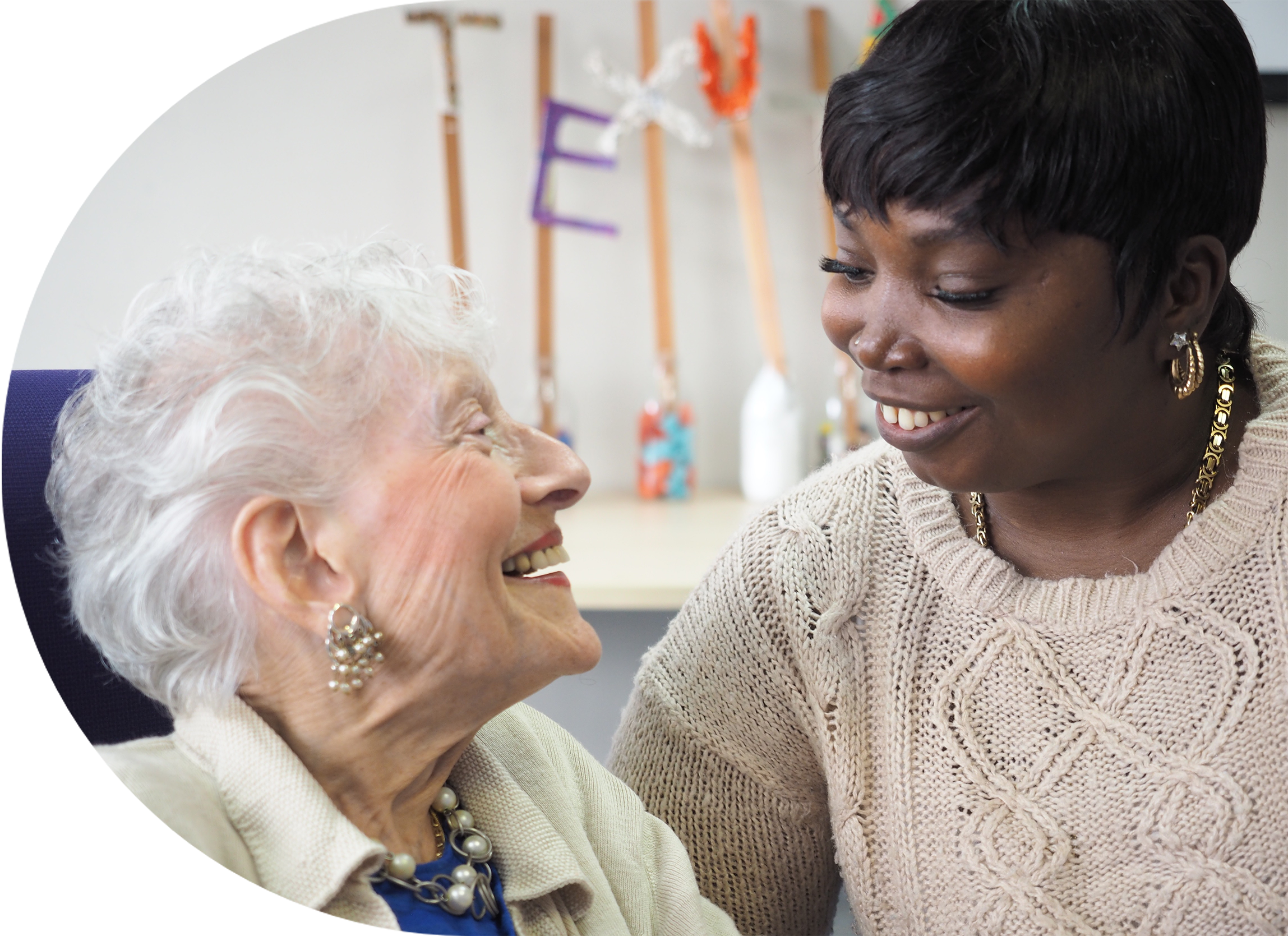 Engage | Schonfeld Square staff interacting with a resident
